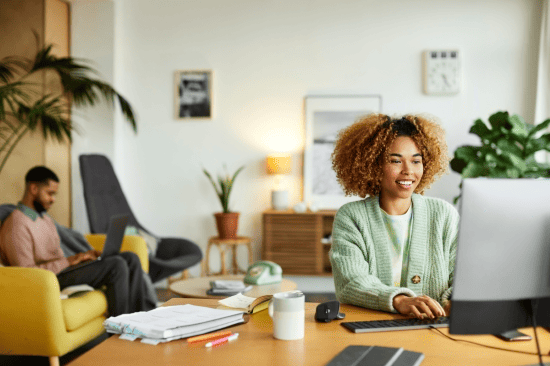 Woman working at a computer in a home office